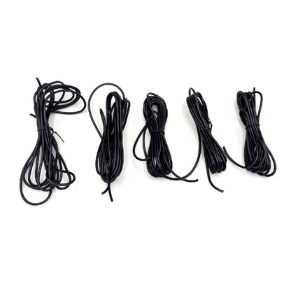 Five coiled lengths of black elastic cord or shoelace arranged in a row on a plain white background.