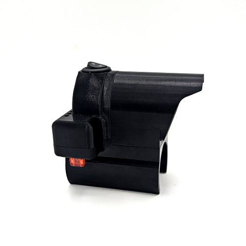 A black plastic 3D-printed mechanical component or part with a small red indicator light, shown on a plain white background.
