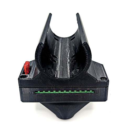 A 3D-printed black plastic component, likely a 3D printer hotend accessory or custom nozzle assembly, featuring a curved upper section, a rectangular base with a green linear guide, and a red adjustment knob, shown on a white background.