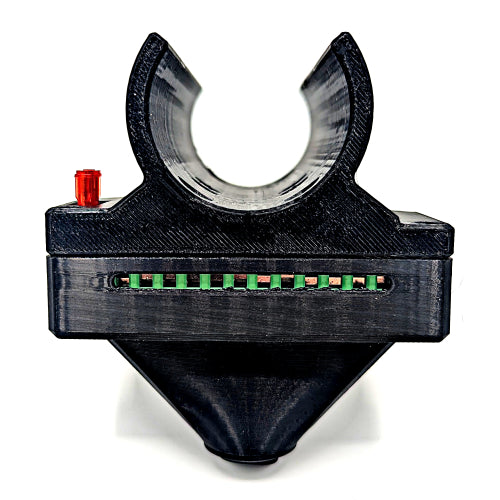 Black mechanical component with green and red elements on a white background